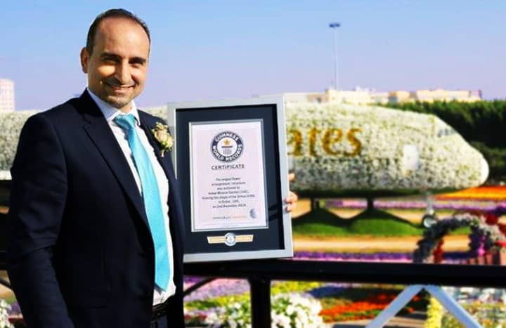 Abdel Naser Rahhal receiving Guinness World Record for building the world's largest floral arrangement/structure.