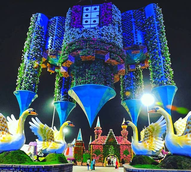 A night time photograph of the Inverted Castle at the Dubai Miracle Garden.