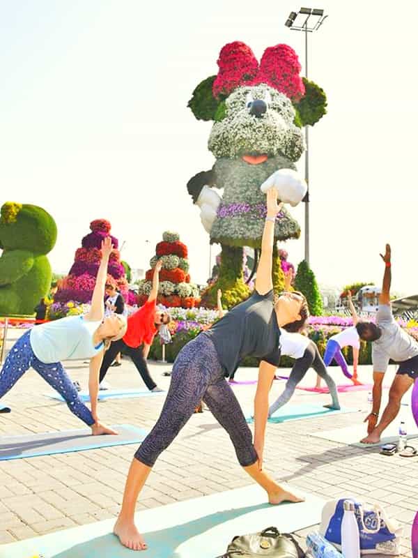 women enthusiastically partcipated the yoga event at Dubai Miracle Garden