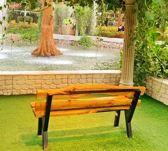Sit near the pond of the Dubai Miracle Garden
